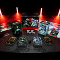 Card game components including cards, dice, and a box on a dark surface with red lighting.