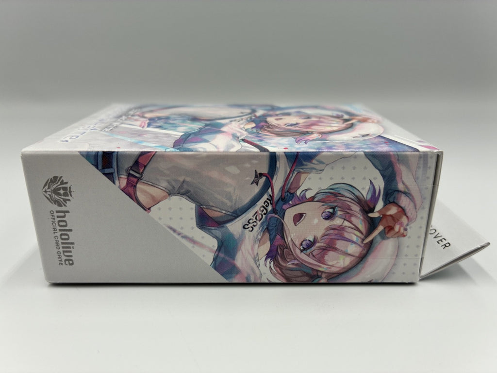 A boxed collectible figure package with anime-style character artwork on the front and side panels, photographed against a plain light gray studio background. The visible text/logo reads Hololive.