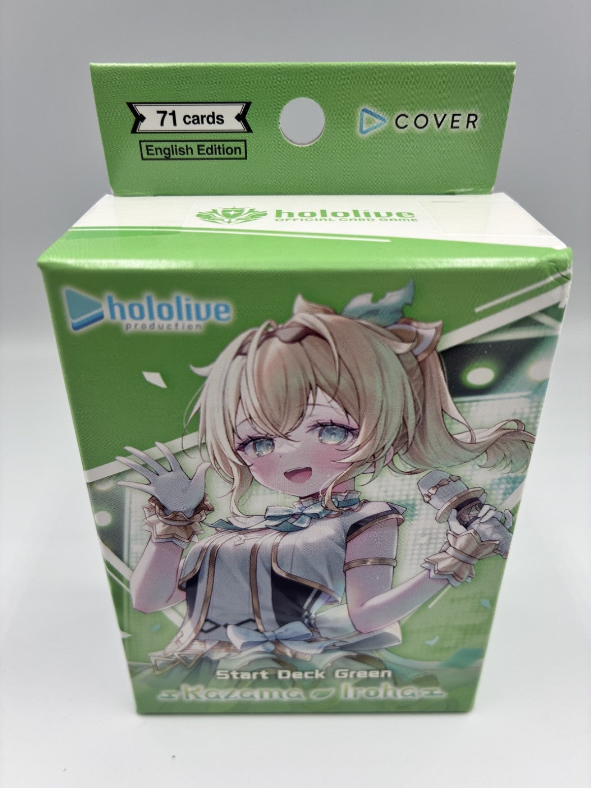 A green Hololive card deck box featuring an anime illustration of Revoma Inui on the front, with a top flap labeled '71 cards English Edition' and 'COVER' printed on the cover.