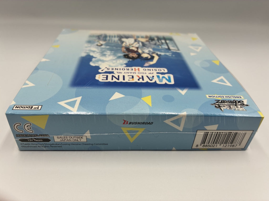 A sealed blue box for the card game Too Many Losing Heroines English Edition.