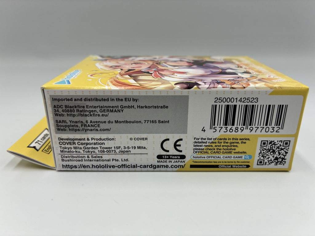 The back of a yellow and white box for the card game, showing printed text, a barcode, a QR code, and an illustration of anime characters on a light gray background.